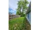 A fenced yard provides privacy and security with lush greenery and well-maintained landscaping at 9134 Jene Ct, Indianapolis, IN 46234