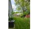 A fenced yard provides privacy and security with lush greenery and well-maintained landscaping at 9134 Jene Ct, Indianapolis, IN 46234