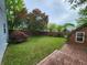 Backyard with wooden deck, shed, and plenty of green space for outdoor activities and entertaining at 9134 Jene Ct, Indianapolis, IN 46234