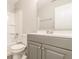 Bathroom featuring gray vanity, white toilet, and white tub with shower at 9134 Jene Ct, Indianapolis, IN 46234