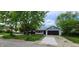 Charming home featuring a two-car garage, lovely landscaping, and a well-maintained front yard at 9134 Jene Ct, Indianapolis, IN 46234
