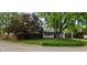 Well-maintained front yard showing lush greenery, healthy trees, and the home's appealing exterior at 9134 Jene Ct, Indianapolis, IN 46234