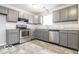 Modern kitchen with stainless steel appliances, granite countertops, and ample cabinet space at 9134 Jene Ct, Indianapolis, IN 46234