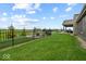 Spacious green backyard with a black fence, ideal for outdoor activities and entertaining at 920 Alba Dr, Lebanon, IN 46052