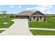 Charming single-story home featuring a well-manicured lawn and inviting stone accents at 920 Alba Dr, Lebanon, IN 46052