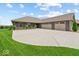 Attractive single-story home with a spacious driveway and well-maintained landscaping at 920 Alba Dr, Lebanon, IN 46052