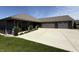 Lovely home features a manicured lawn, spacious driveway, and a welcoming entrance at 920 Alba Dr, Lebanon, IN 46052