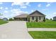 Beautiful single-story home with a long driveway and attractive stone detailing at 920 Alba Dr, Lebanon, IN 46052