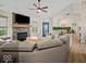 Inviting living room boasts a stone fireplace and views of the outdoor space at 920 Alba Dr, Lebanon, IN 46052