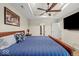 Main bedroom has a tray ceiling, ceiling fan, and is brightly lit with natural light at 920 Alba Dr, Lebanon, IN 46052