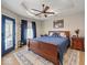 This bedroom boasts natural light, a ceiling fan, and is tastefully decorated at 920 Alba Dr, Lebanon, IN 46052