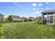 Large, well-maintained backyard with lush green grass, mature trees, and privacy fencing at 952 Workington Cir, Westfield, IN 46074