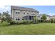 Expansive backyard featuring a screened-in porch, lush green lawn, and manicured landscaping at 952 Workington Cir, Westfield, IN 46074