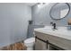 Modern half-bath features updated vanity, contemporary fixtures, and stylish gray walls at 952 Workington Cir, Westfield, IN 46074