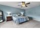 Bedroom featuring neutral walls, plush carpet, ceiling fan, and a comfortable bed at 952 Workington Cir, Westfield, IN 46074