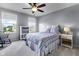 Comfortable bedroom featuring plush carpeting, a ceiling fan, and two windows at 952 Workington Cir, Westfield, IN 46074