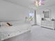 Bright bedroom with a white storage bed, light gray carpet, and a pink ceiling fan with decorative lighting at 952 Workington Cir, Westfield, IN 46074