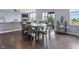 Cozy dining area featuring hardwood floors, a large table with seating, and natural light from nearby windows at 952 Workington Cir, Westfield, IN 46074