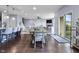 Dining room features hardwood floors with access to living room, kitchen, and sliding glass door at 952 Workington Cir, Westfield, IN 46074
