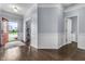 Inviting foyer features hardwood floors, neutral walls, and a red front door that leads to the outdoors at 952 Workington Cir, Westfield, IN 46074