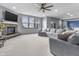 Spacious living room with large windows, a brick fireplace, and comfortable gray seating at 952 Workington Cir, Westfield, IN 46074