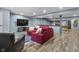 Finished basement living room features a grey rug and red couches at 952 Workington Cir, Westfield, IN 46074