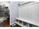 Functional mudroom featuring a built-in bench with cubbies and coat hooks at 952 Workington Cir, Westfield, IN 46074