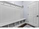 Well-organized mudroom with a built-in bench, hooks, and storage cubbies at 952 Workington Cir, Westfield, IN 46074