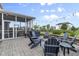 Outdoor brick patio with fire pit and overhead string lights, perfect for entertaining at 952 Workington Cir, Westfield, IN 46074
