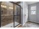 Shower with glass doors and tiled surround offers a spa-like experience at 952 Workington Cir, Westfield, IN 46074