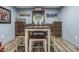 Basement wine cellar features built-in racks and a dining set at 952 Workington Cir, Westfield, IN 46074