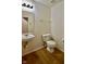 Bathroom with a single sink, toilet, and wood-style flooring at 9613 W Stargazer Dr, Pendleton, IN 46064