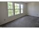 Bright bedroom featuring three windows and carpeted floor at 9613 W Stargazer Dr, Pendleton, IN 46064