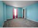 Spacious bedroom with blue walls and window with pink curtains at 9613 W Stargazer Dr, Pendleton, IN 46064