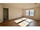 Neutral bedroom featuring wood-look floors, neutral walls, and double windows at 9613 W Stargazer Dr, Pendleton, IN 46064
