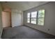 Bedroom featuring three windows and carpeted floor and a closet at 9613 W Stargazer Dr, Pendleton, IN 46064