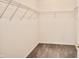 Walk-in closet with gray carpet and an installed shelving system at 9613 W Stargazer Dr, Pendleton, IN 46064