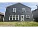 Exterior showcasing the home's rear facade with gray siding and multiple windows at 9613 W Stargazer Dr, Pendleton, IN 46064