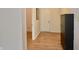 Hallway with access to the front door and with wood-style flooring at 9613 W Stargazer Dr, Pendleton, IN 46064