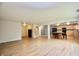 Open-concept living room with wooden floors and an eat-in kitchen at 9613 W Stargazer Dr, Pendleton, IN 46064