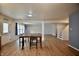 Spacious living room area with wood flooring and a breakfast table at 9613 W Stargazer Dr, Pendleton, IN 46064
