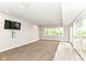 Spacious finished basement with modern lighting, tv, neutral decor, and walk out to patio at 9790 Summerlakes Dr, Carmel, IN 46032