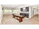 Finished basement with bar area, seating, and space for recreation and entertaining at 9790 Summerlakes Dr, Carmel, IN 46032