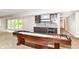Finished basement featuring a wet bar, game table, and access to the outdoors through the french doors at 9790 Summerlakes Dr, Carmel, IN 46032