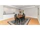 Charming dining room with hardwood floors and a view into the home at 9790 Summerlakes Dr, Carmel, IN 46032
