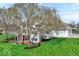 Large, two-story home with a well-maintained lawn and mature trees at 9790 Summerlakes Dr, Carmel, IN 46032