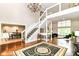 Elegant foyer featuring a staircase, high ceilings, chandelier and hardwood floors at 9790 Summerlakes Dr, Carmel, IN 46032