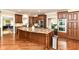 Gourmet kitchen with granite countertops, stainless appliances, and custom cabinetry at 9790 Summerlakes Dr, Carmel, IN 46032