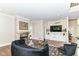 Comfortable living room with fireplace, tv, and built-in shelving at 9790 Summerlakes Dr, Carmel, IN 46032