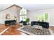 Spacious living room with large windows and high ceiling at 9790 Summerlakes Dr, Carmel, IN 46032